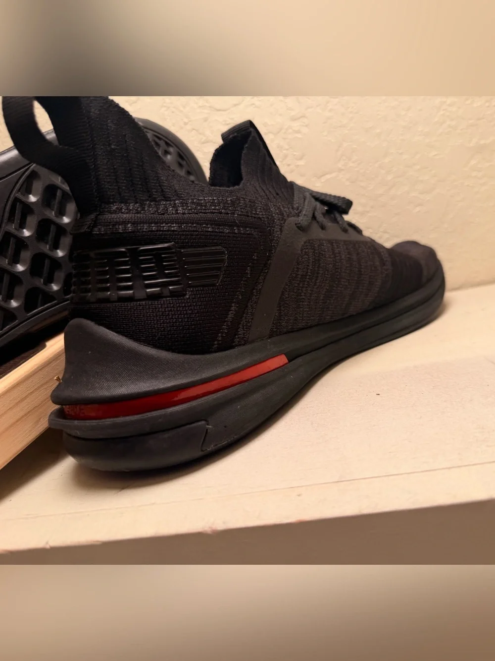 Puma Men’s Black Knit Athletic Sneaker with Red Accent